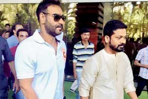 Ajay Devgn recovers from tennis elbow; attends a puja for his new VFX office