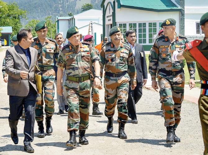 Chief of the Army Staff, General Bipin Rawat and 15 Corps Commander Lt General A K Bhatt take a round of Army Goodwill Public School, Lidru Pahalgam in Anantnag district. Pic/PTI