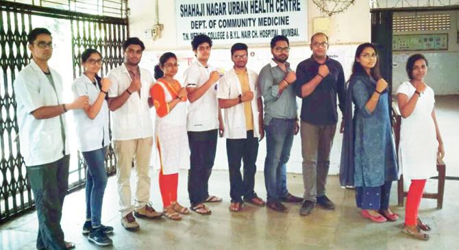 Nair and KEM hospital doctors wear black ribbons to mark their protest