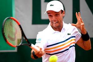 Roberto Bautista Agut battles to reach French Open 2nd round