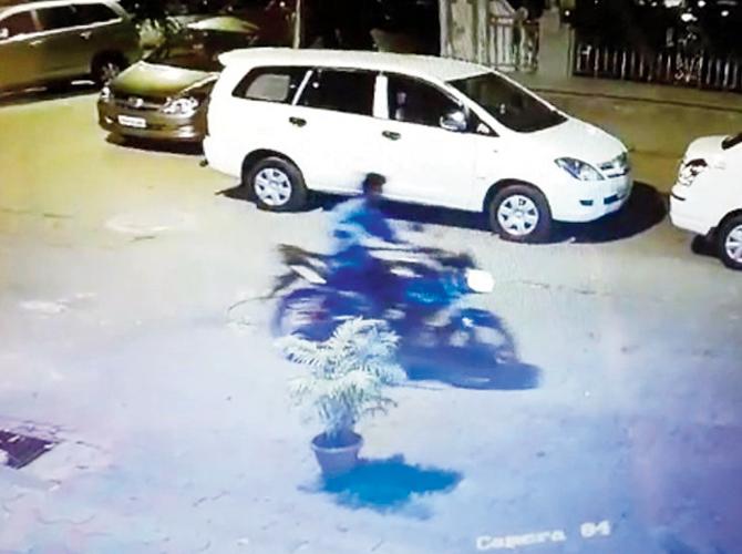 The CCTV grab of a youth on a Pulsar bike in the area where the crime occurred that led to the arrest of Colaba resident Luv Kule (below)