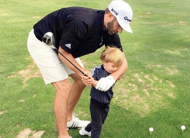 Dustin Johnson with son Tatum