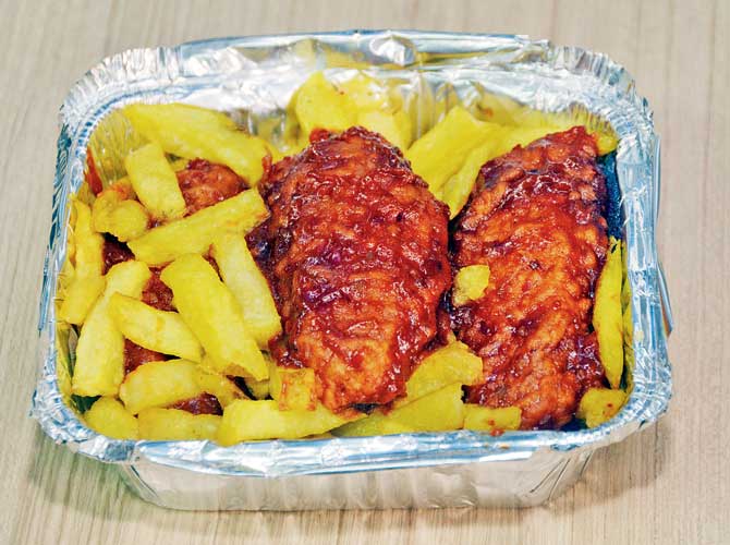 Fiery chicken wings and fries