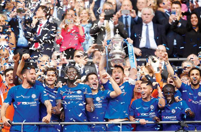 Chelsea captain Gary Cahill lifts the FA Cup following his team’s 1-0 win over Manchester United at Wembley on Saturday. Pic/Getty Images