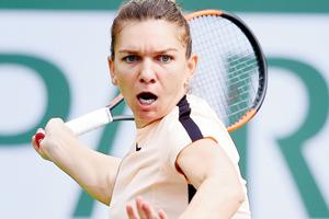 Simona Halep retains top spot with win over Garcia
