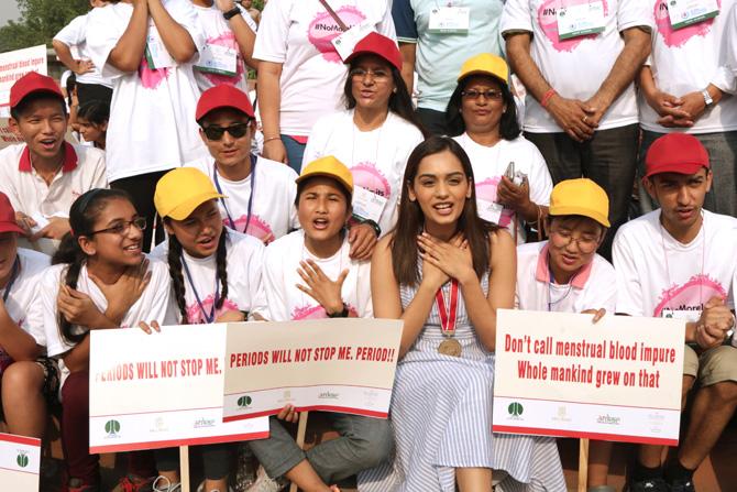 Miss World 2017 Manushi Chhillar (front 3R) poses with school girls on the occasion of World Menstrual Hygiene Day in Connaught Place in New Delhi on May 28, 2018. Menstrual Hygiene Day is an awareness day to highlight the importance of good menstrual hygiene management. Pic/AFP