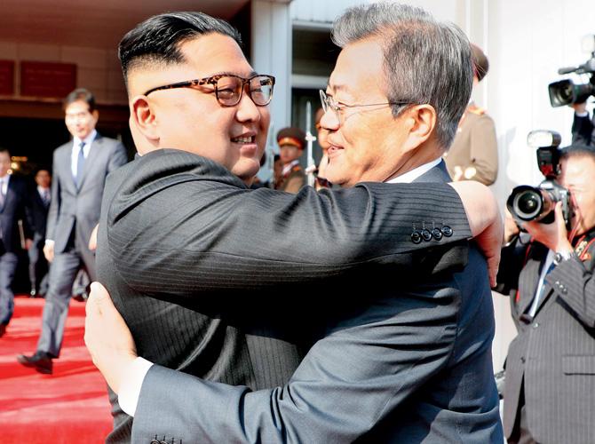 Kim Jong Un (left) with Moon Jae-in at DMZ. Pic/AFP