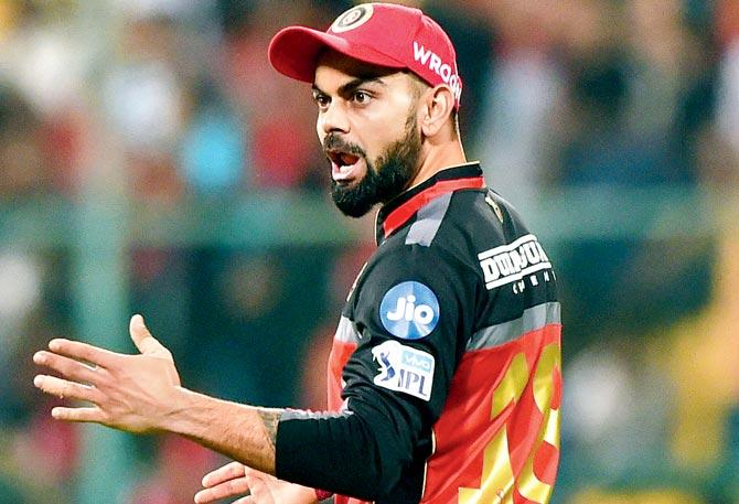 RCB skipper Virat Kohli reacts against KKR on Sunday. Pic/PTI