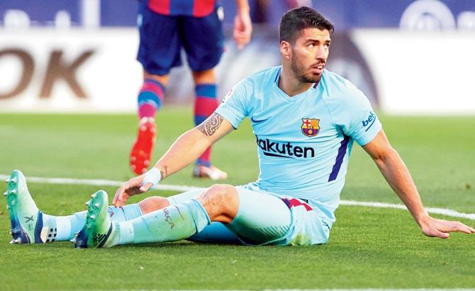 Barca striker Luis Suarez wears a dejected look during the La Liga match against Levante in Spain on Sunday. Pic/Getty Images