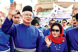 Malaysia's scandal-mired Najib Razak hit with travel ban