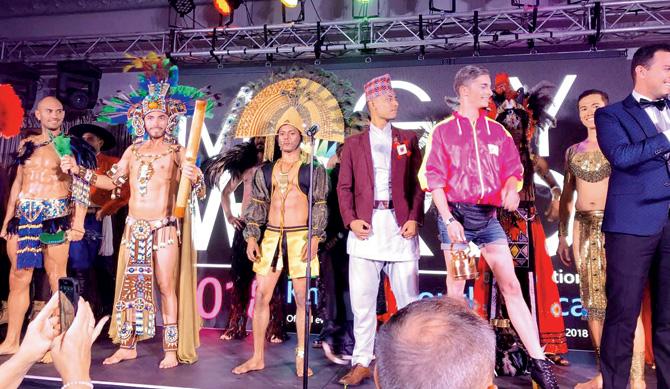 Samarpan Maiti (third from left) on stage in the national costume round of the pageant in South Africa