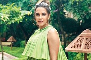 Post marriage, Neha Dhupia all tied up with work