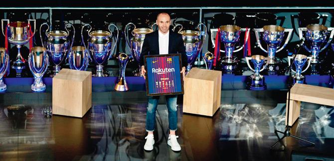 Andres Iniesta is felicitated at Camp Nou on Saturday. pic/AFP