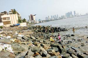 Mahim beach clean up: PWD machines fail to clear Mahim beach of erosion rocks