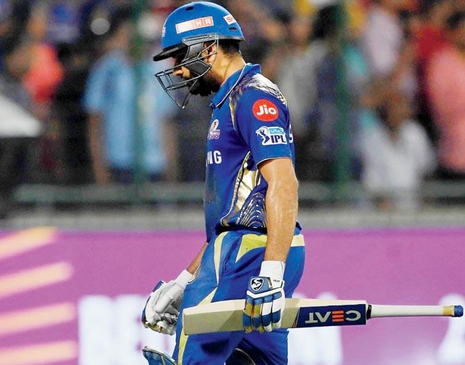 Mumbai skipper Rohit Sharma walks back after being dismissed for 13 against DD at the Feroz Shah Kotla yesterday. Pic/AFP