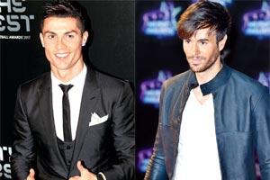 Cristiano Ronaldo gives thumbs up to pop star Enrique Iglesias' gesture