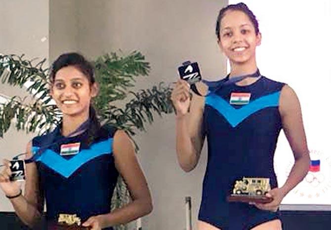 Gymnasts Shivani Dound (right) and Siddhi Breed on the podium
