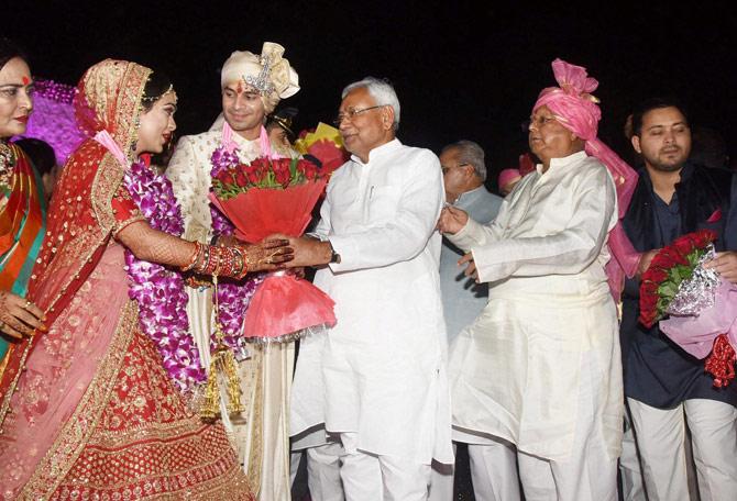Bihar Chief Minister Nitish Kumar greets RJD chief Lalu Prasad Yadav