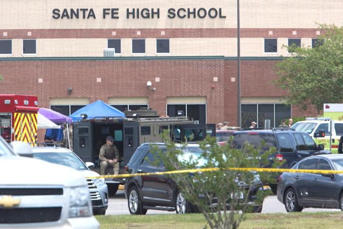 Emergency crews gather in the parking lot of Santa Fe High School where at least ten people were killed on May 18, 2018 in Santa Fe, Texas. At least ten people were killed when a student opened fire at his Texas high school on May 18, 2018, as President Donald Trump expressed "heartbreak" over the latest deadly school shooting in the United States. The shooting took place as classes were beginning for the day at Santa Fe High School in the city of the same name, located about 30 miles (50 kilometers) southeast of Houston."There are multiple fatalities," Harris County Sheriff Ed Gonzalez told reporters. "There could be anywhere between eight to 10, the majority being students." Pic/AFP