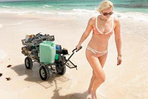 Lindsey Vonn in nude-coloured two-piece bikini cleans trash at Bahamas beach