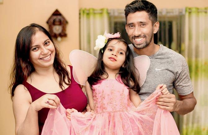Wriddhiman Saha with wife Romi and daughter Anvi