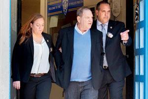 Harvey Weinstein charged with rape following NY arrest