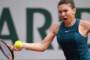 French Open 2018: Halep recovers from first set setback to reach second round