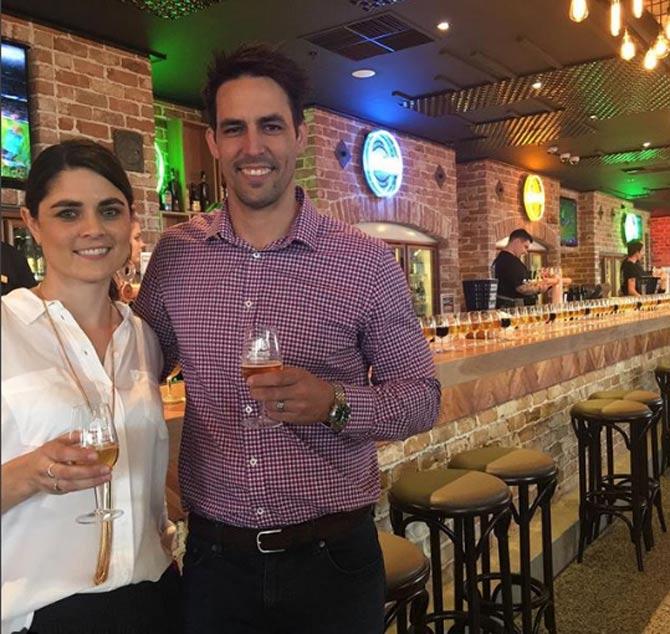 Mitchell Johnson had a wonderful tenure in the IPL, where he played for Mumbai Indians. Kings XI Punjab and Kolkata Knight Riders. Mitchell Johnson had a wonderful tenure with the Mumbai Indians where he played  between the years 2013 and 2017. In pic: Mitchell Johnson is spotted here with his wife Jessica at the opening of a restaurant, captioned, 'It's officially open @wbcbeerland @westfieldwhitfordcity and what a great brew !!!#cheers #beer #barfly'