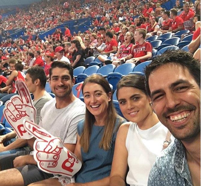 Mitchell Johnson posted this picture of himself with his wife and friends, catching a basketball game. Johnson captioned, 'Loved your work @perthwildcats & thanks for the tickets @greg4hire #3pointkiller !!!!! Go well in the finals series'