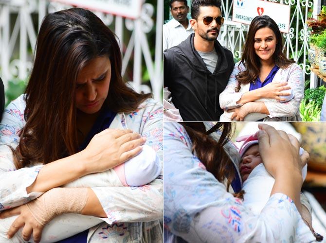 Neha Dhupia and her husband Angad Bedi were blessed with a baby girl on November 18, 2018. Angad on November 20 tweeted a health update of the mother-daughter duo. 'The last two days have been very overwhelming. Neha and me have been blessed with a beautiful baby girl. Thank you all for your wishes and love that is coming our way. Both my girls are doing really well,' he wrote. In picture: Neha Dhupia and Angad Bedi were spotted with their daughter Mehr Dhupia Bedi outside Khar hospital, where the actress delivered her baby.