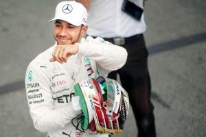 Mercedes's Lewis Hamilton celebrates after claiming pole position at Sao Paulo, Brazil on Saturday. Pic/AFP