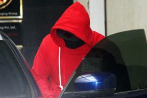 Why is Arjun Kapoor hiding his face from the paparazzi?