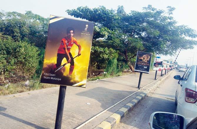 Posters of international hockey stars adorn the footpath of the street near Bhubaneswar airport