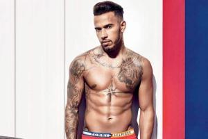 Decoding F1 star Lewis Hamiltons tattoos  Rediff Sports