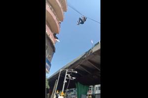 Trick not treat: Man hanging on a wire at JJ flyover falls on the road