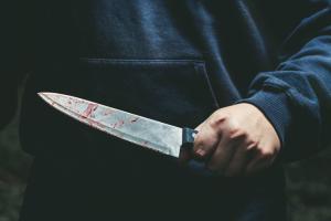 Man butchers friend with knife on road, on-lookers film bloody murder