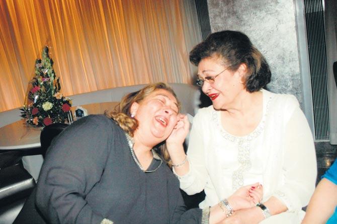 Krishna Raj Kapoor with her daughter Rima Jain, who is clicked having a hearty laugh alongside her mother.