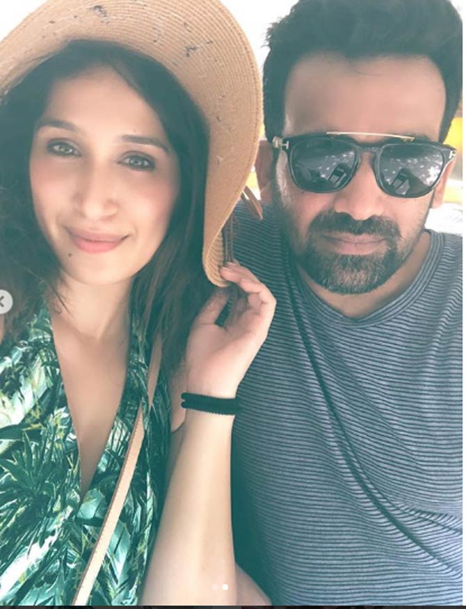 Sagarika Ghatge is spotted here wearing a green top with a hat, while Zak is keeping it cool with black shades and a smart casual shirt