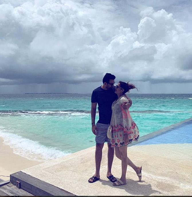 The clouds, the sand, the ocean and the lovely couple! everything looks picture perfect in this capture. Sagarika Ghatge captioned, 'With the #birthdayboy!! wearing @hemantnandita'