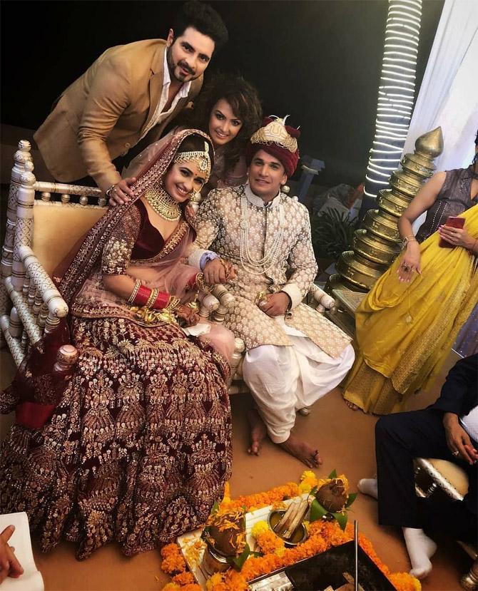 Popular for his stint as Naitik in the television show Yeh Rishta Kya Kehlata Hai, actor Karan Mehra also attended Prince Narula and Yuvika Chaudhary's wedding. In the picture, he is seen with wife Nisha Rawal, as they happily pose for this beautiful click with the newlyweds. There are also videos of the couple reciting their wedding vows while completing the wedding rituals. Talking about the couple's wedding card, the invite was designed by Anushka Sharma and Virat Kohli's wedding invitation card designer.