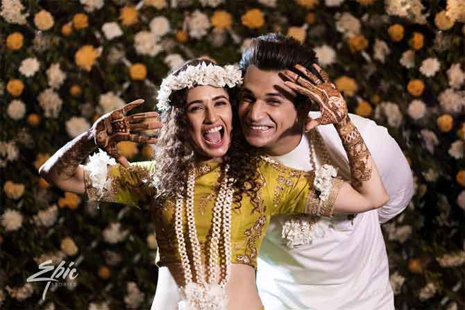 Prior to the function, Prince Narula and Yuvika Chaudhary had a ball at their Mehendi ceremony too. The henna drawn on her hands narrated hers and Prince Narula's love story. Dressed in a mint green lehenga and curled tresses, she completed the look with floral jewellery.