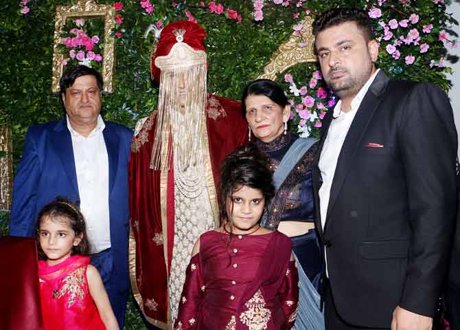 Prince Narula poses for a family photo with his parents while his face is covered with the traditional veil. In one of the recent interviews, Yuvika had mentioned that Prince's parents had approached her parents while they were both in the reality show Bigg Boss' house. 'We were strangers inside the Bigg Boss house. While Prince developed a strong liking for me in the beginning of our stay, I wanted to take some time. We fell in love much after the show ended. I even told him inside the house that if he is trying to be pally with me for the ratings, I am the wrong girl. However, his feelings were genuine. He would often tell me that I should talk more, as he feared that I wouldn't last for long on the show (laughs!). We are one of those few jodis whose love blossomed on the reality show,' shared Yuvika.