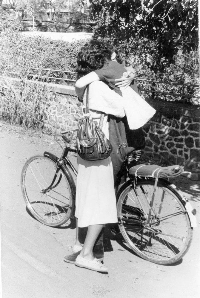 Love in times of cycle! A couple captured in a tight embrace in a vintage photo clicked by mid-day photographer   