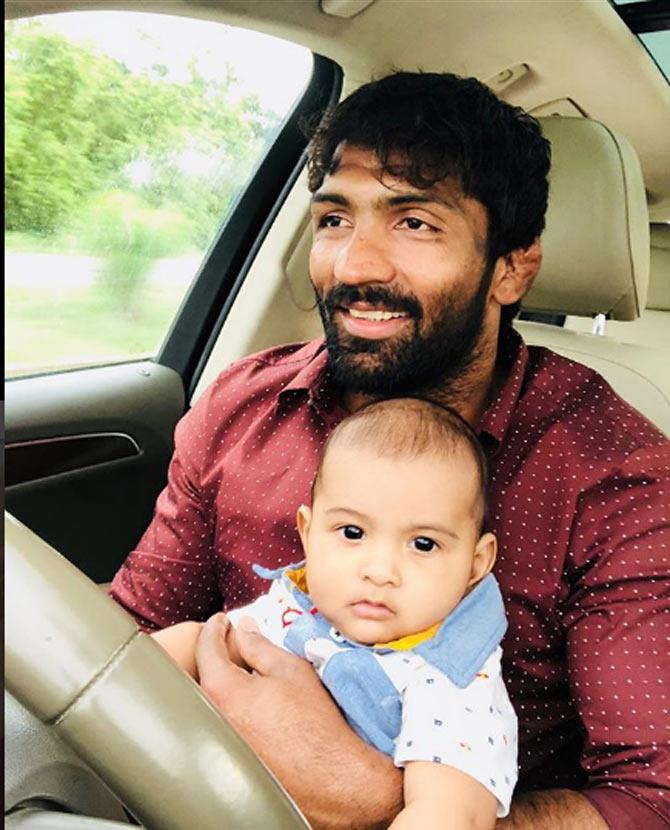 Yogeshwar Dutt shared this picture of himself and his son, out on a drive. Yogeshwar Dutt wrote, 'Every father should remember that one day his son will follow his example instead of his advice..'