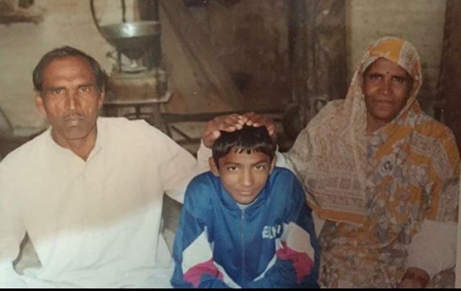 In picture: Yogeshwar Dutt posted this throwback picture of himself with his father and mother on Father's Day. Yogeshwar Dutt wrote, 'If you want to see the nature of God, just look at your parents, you will see God in them #Happyfathersday'