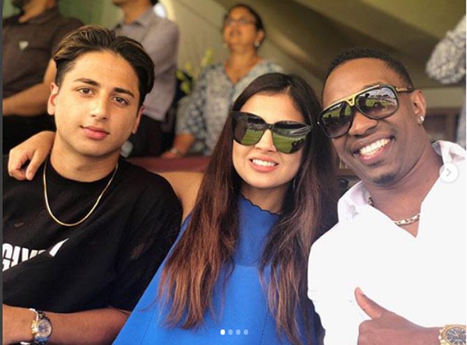 In December 2019, Dwayne Bravo came out of retirement in order to prepare for the T20 World Cup in 2020. Dwayne Bravo shared this picture with Sakshi Dhoni and a friend during India's tour of England.