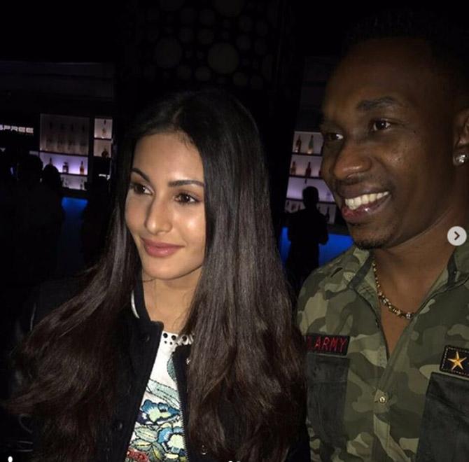 Dwayne Bravo has also been part of controversies, During a Test series against South Africa in 2005, Bravo scored his maiden century before getting out to Mark Boucher in the fourth Test in Antigua, but that was overshadowed when he accused South African Graeme Smith of directing a racist comment at him. At the subsequent hearing no evidence could be found and charges were dropped against Smith, who immediately demanded an apology from Bravo. Bravo, backed by the West Indies Cricket Board, refused to do so and received a hail of criticism from an indignant South African press while finding support at home as a human rights campaigner. In picture: Dwayne Bravo with Bollywood actress Amyra Dastur
