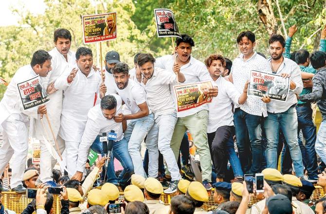 Delhi Pradesh Youth Congress members stage a protest against M J Akbar for his alleged sexual misconduct and harassment of journalists, in New Delhi. Pic/PTI