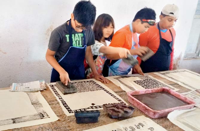 Students from Ascend International try their hand at Ajrakh block printing