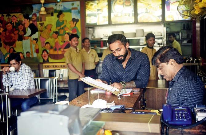 Avinash Shetty with father Appanna M Shetty at Powai-s Akshaya Bar & Restaurant. Shetty Senior says he opened the bar as he realised that the drinking-out concept was becoming popular. "Eating home-style local food with affordable liquor is a definite hit," he adds. Pic/Sameer Markande
